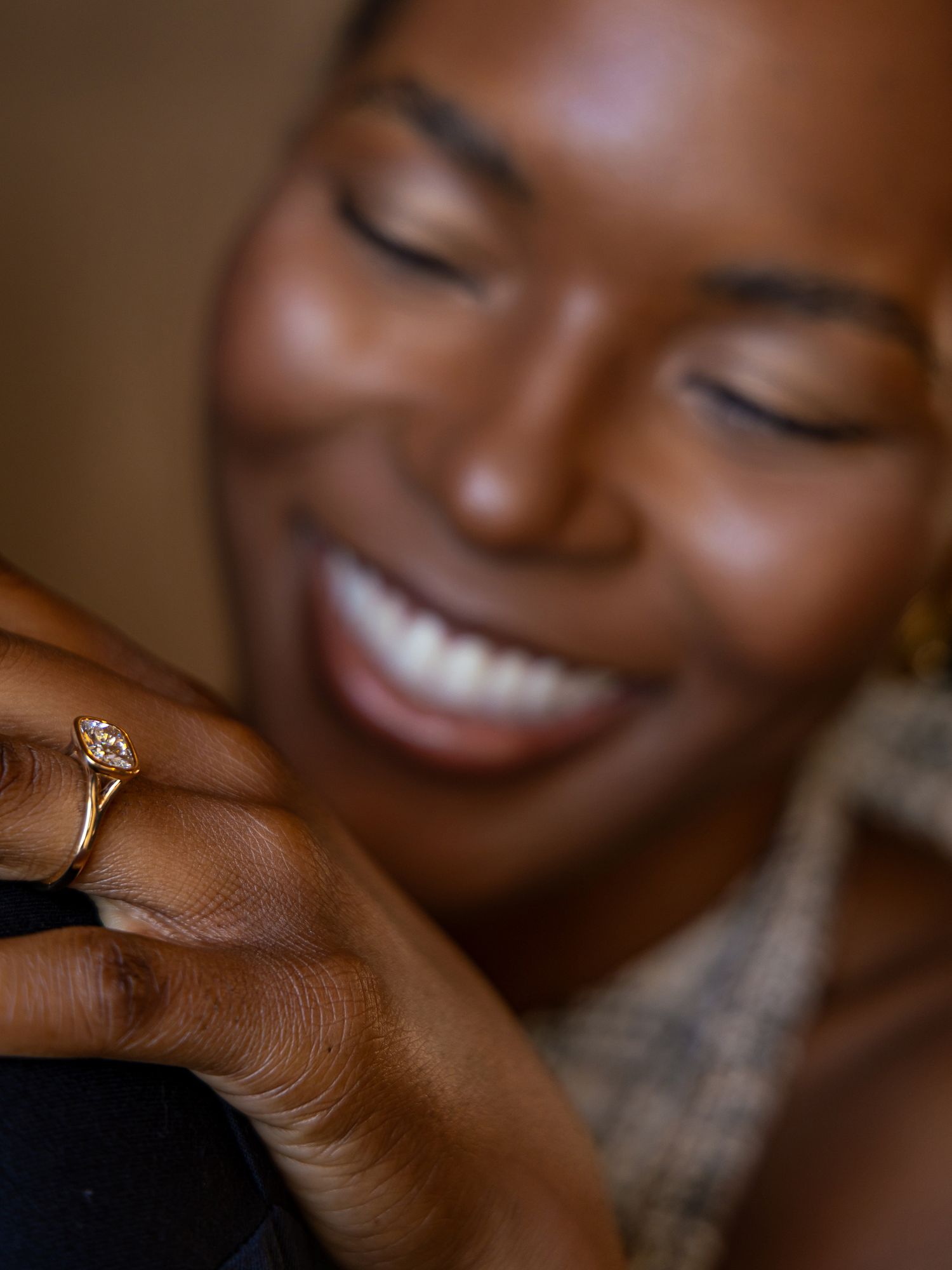 A close-up series showing a diamond engagement ring on a hand with a warm, joyful smile in the background.