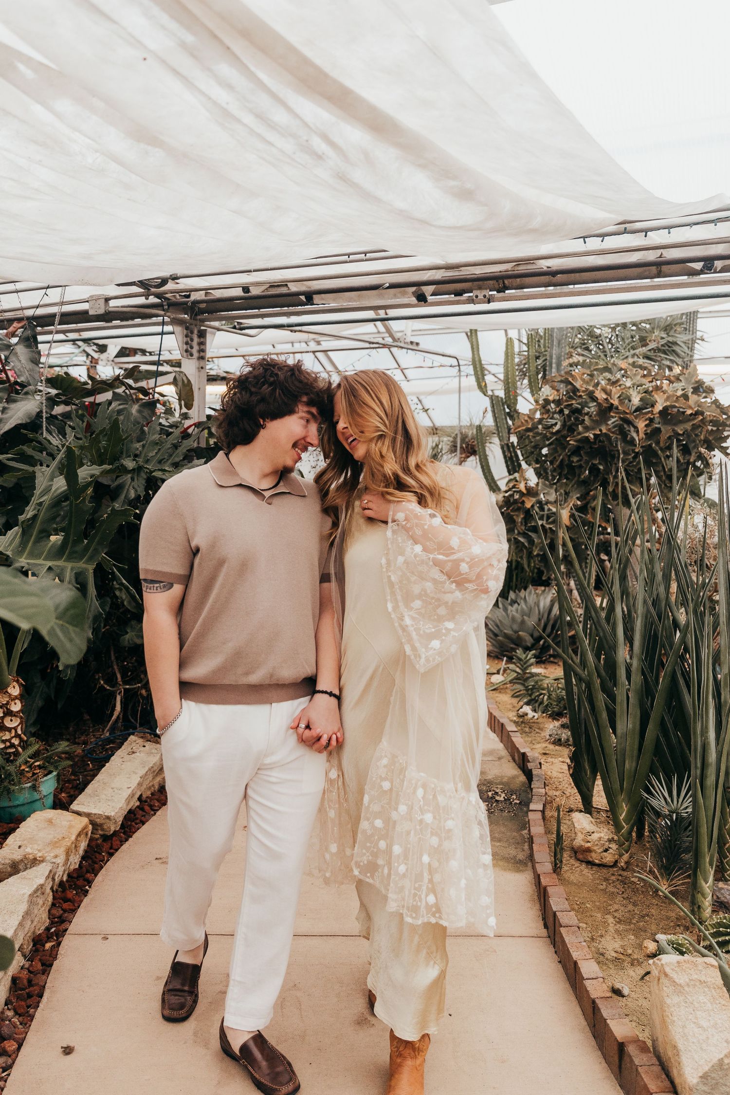 Couple walking in greenhouse