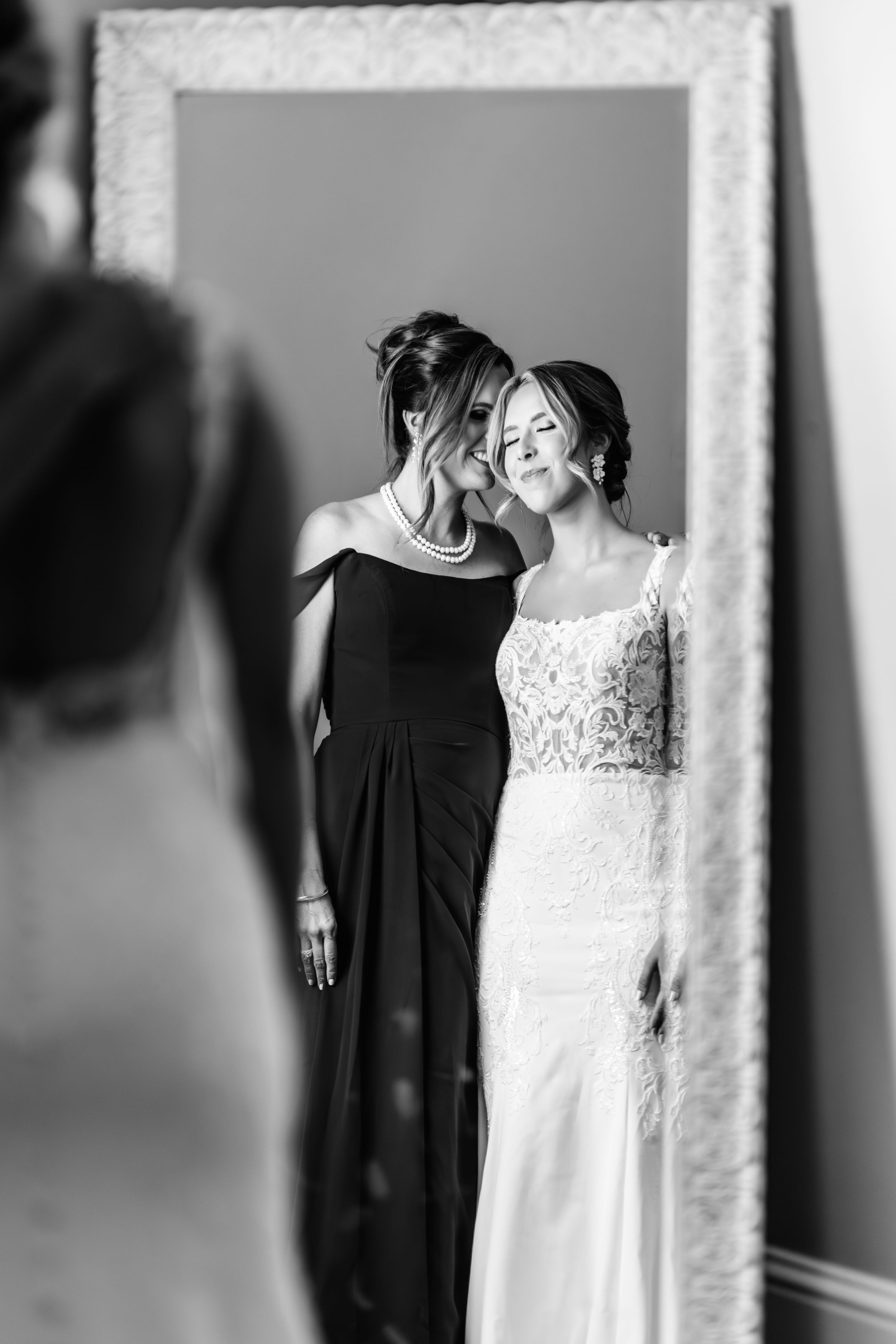 Artistic black and white wedding preparation photos with dress silhouettes. Middle TN wedding photographer.