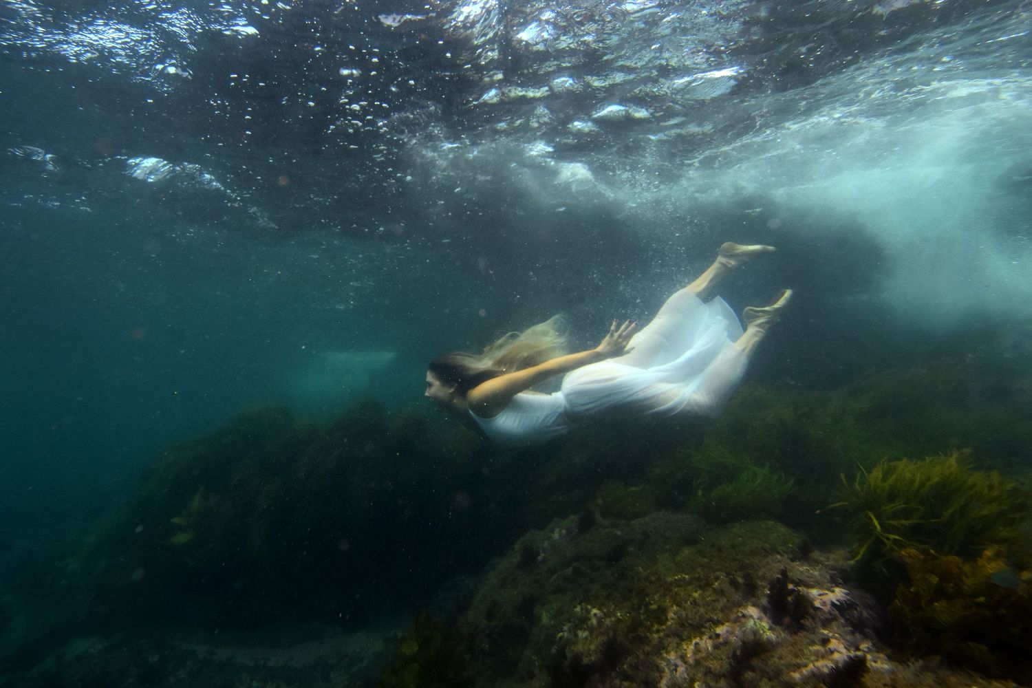 Authentic, emotive portrait underwater photography that captures real moments, true connection, and the unique essence of every individual.