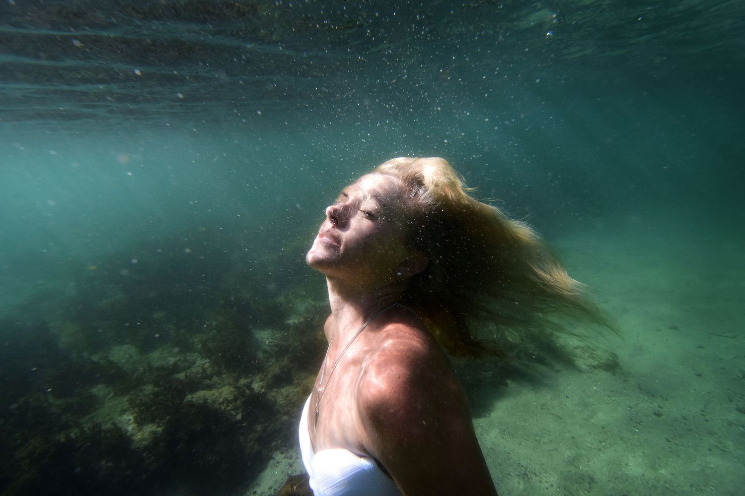 Ethereal underwater portraits that capture weightless beauty, raw emotion, and the fluid artistry of life beneath the surface.
