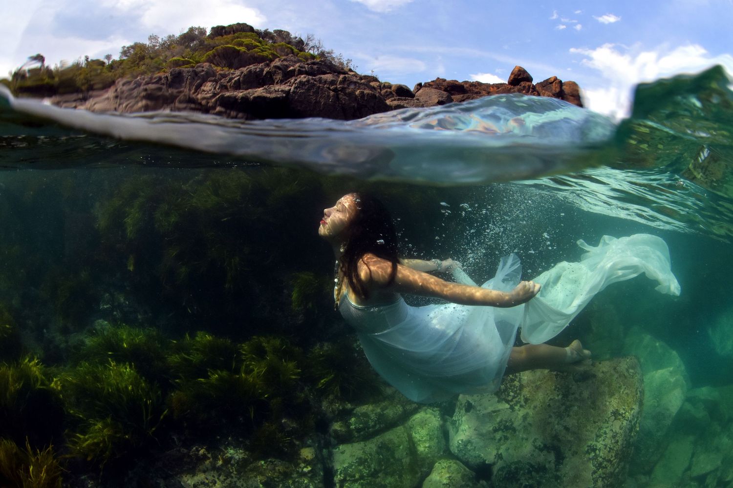 Ethereal underwater portraits that capture weightless beauty, raw emotion, and the fluid artistry of life beneath the surface.