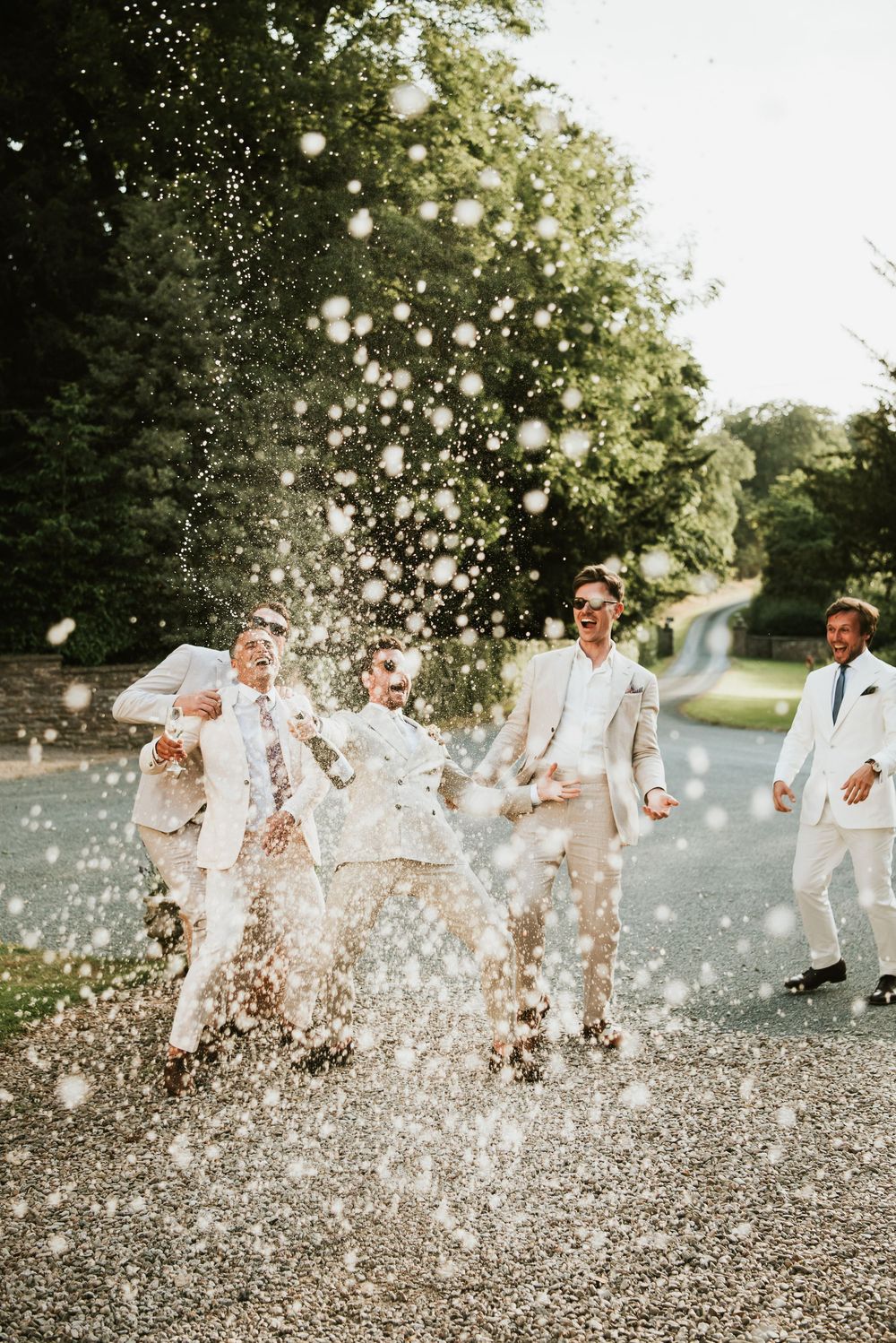Broadfield Court Wedding Venue. Champagne Spray Photo Idea. Herefordshire wedding photography - Rosie Kelly Photography