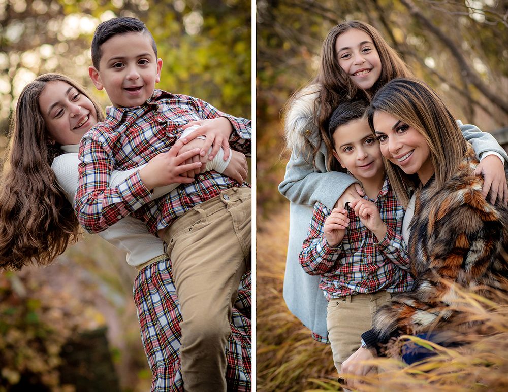 Candid family photography session with playful poses in outdoor autumn setting.