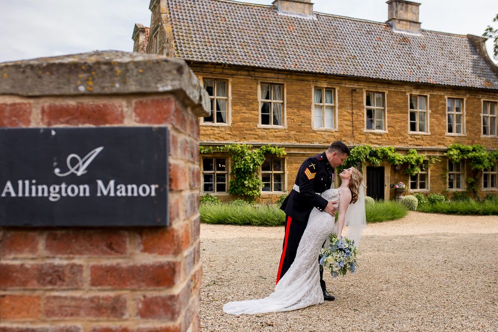 Historic manor house wedding venue with traditional brick architecture and courtyard.