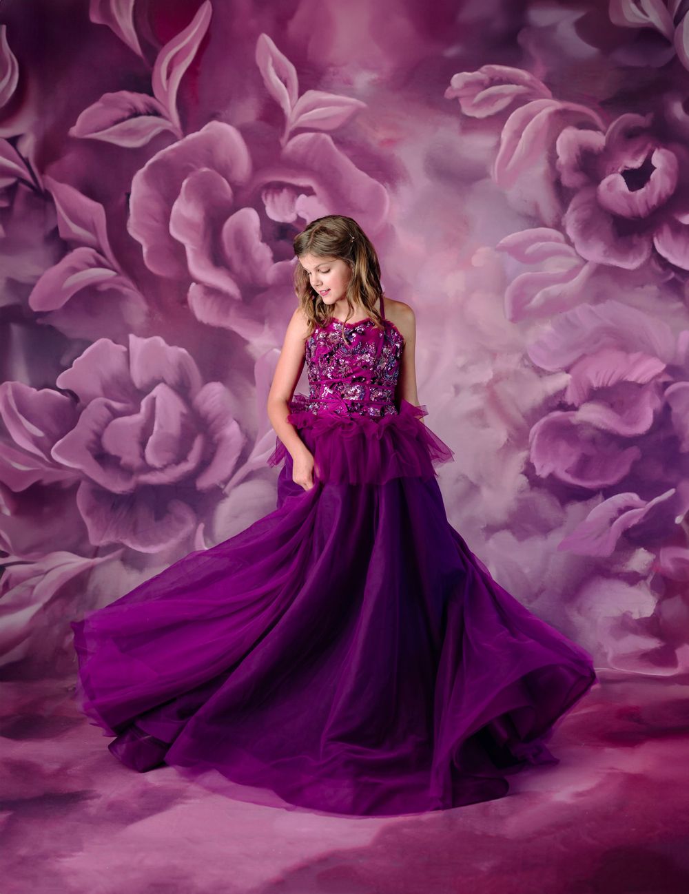 dream dress couture session in broken arrow oklahoma indoor photography studio; magenta gown on magenta backdrop with girl twirling