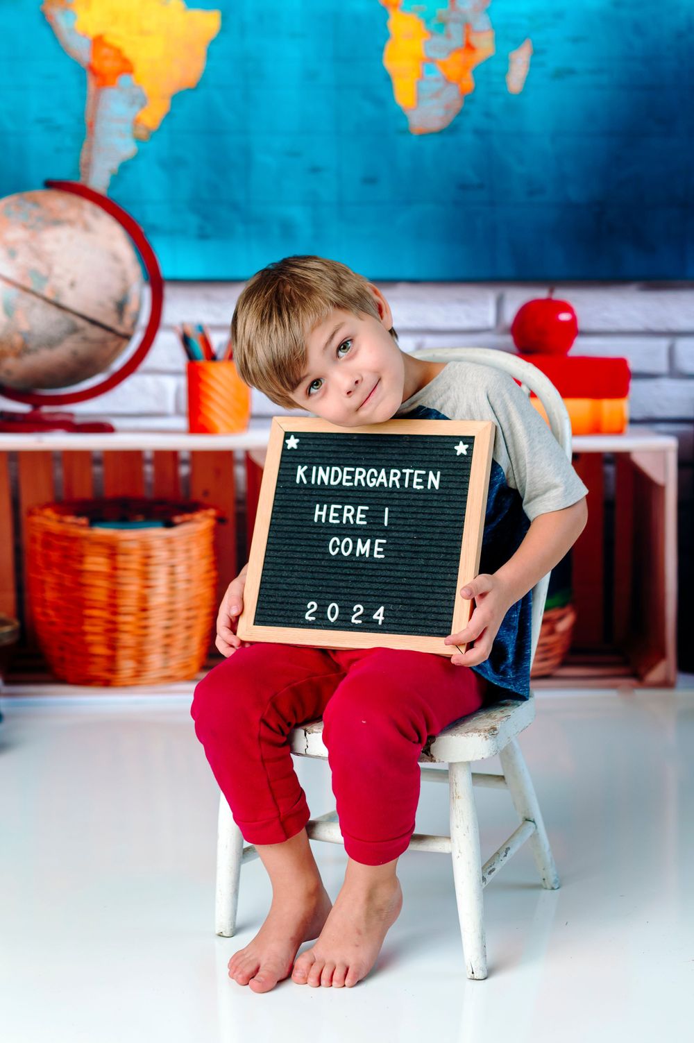 kindergarten indoor photography studio session in broken arrow oklahoma; back to school session with map and globe; elementary school