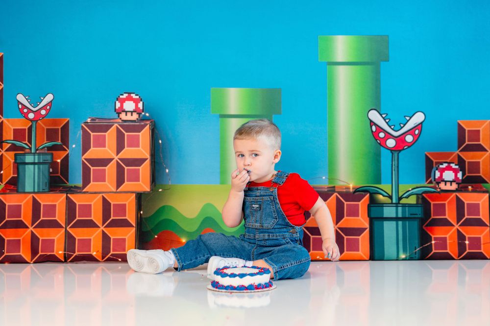 super mario brothers milestone session at indoor photography studio in broken arrow oklahoma; mario and luigi mario theme set with cake