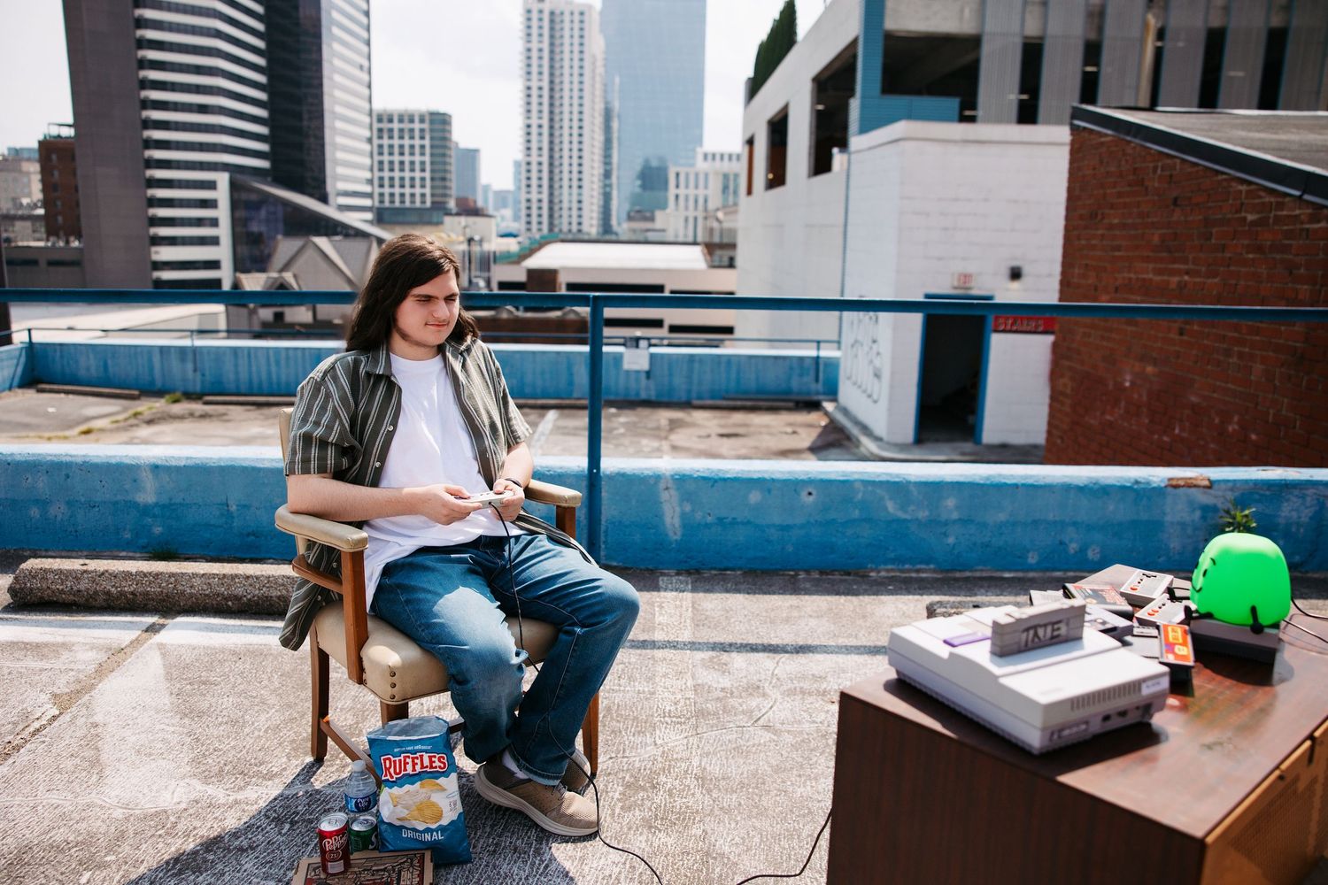 A series of photos showing someone studying at a desk with a laptop and books against an urban skyline backdrop.