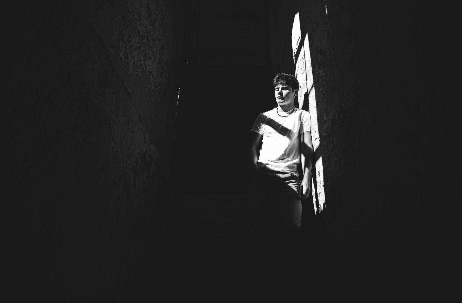 Black and white silhouette of a senior guy with window light.  Middle TN senior photographer.