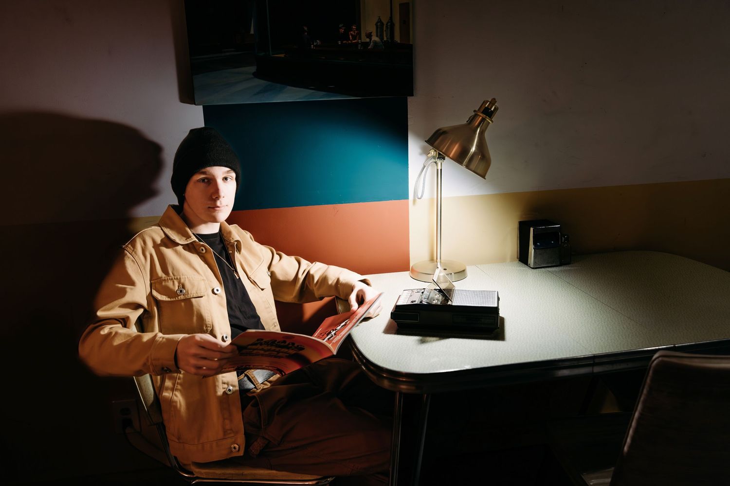Dramatic low light photo sequence showing a senior working at a desk in dark room.  Middle TN Senior photographer