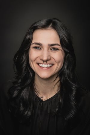 A series of expressive portrait shots showing genuine smiles and dark hair against a black background.