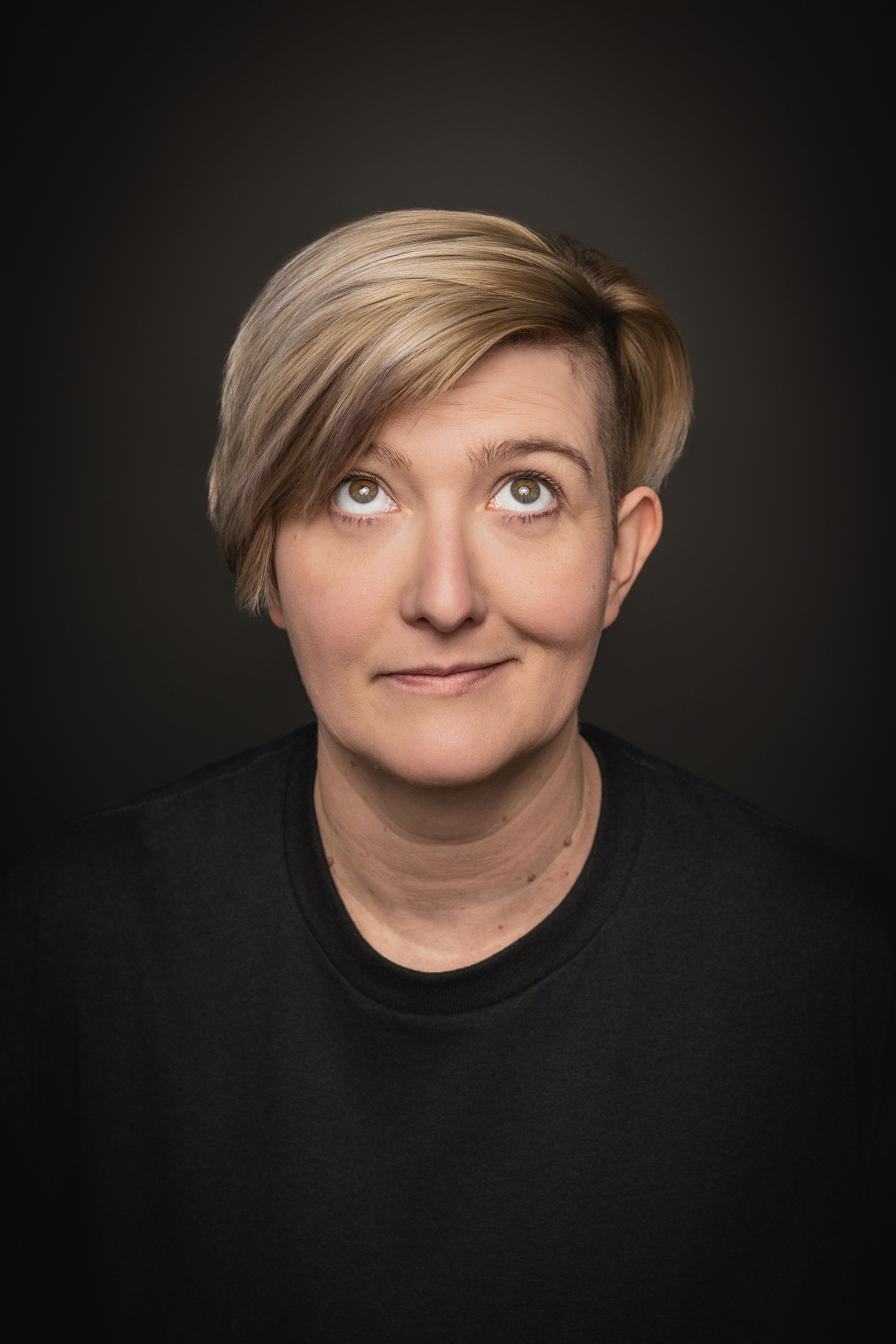 A sequence of four portraits showing a playful expression with blonde hair and a hat against a dark background.