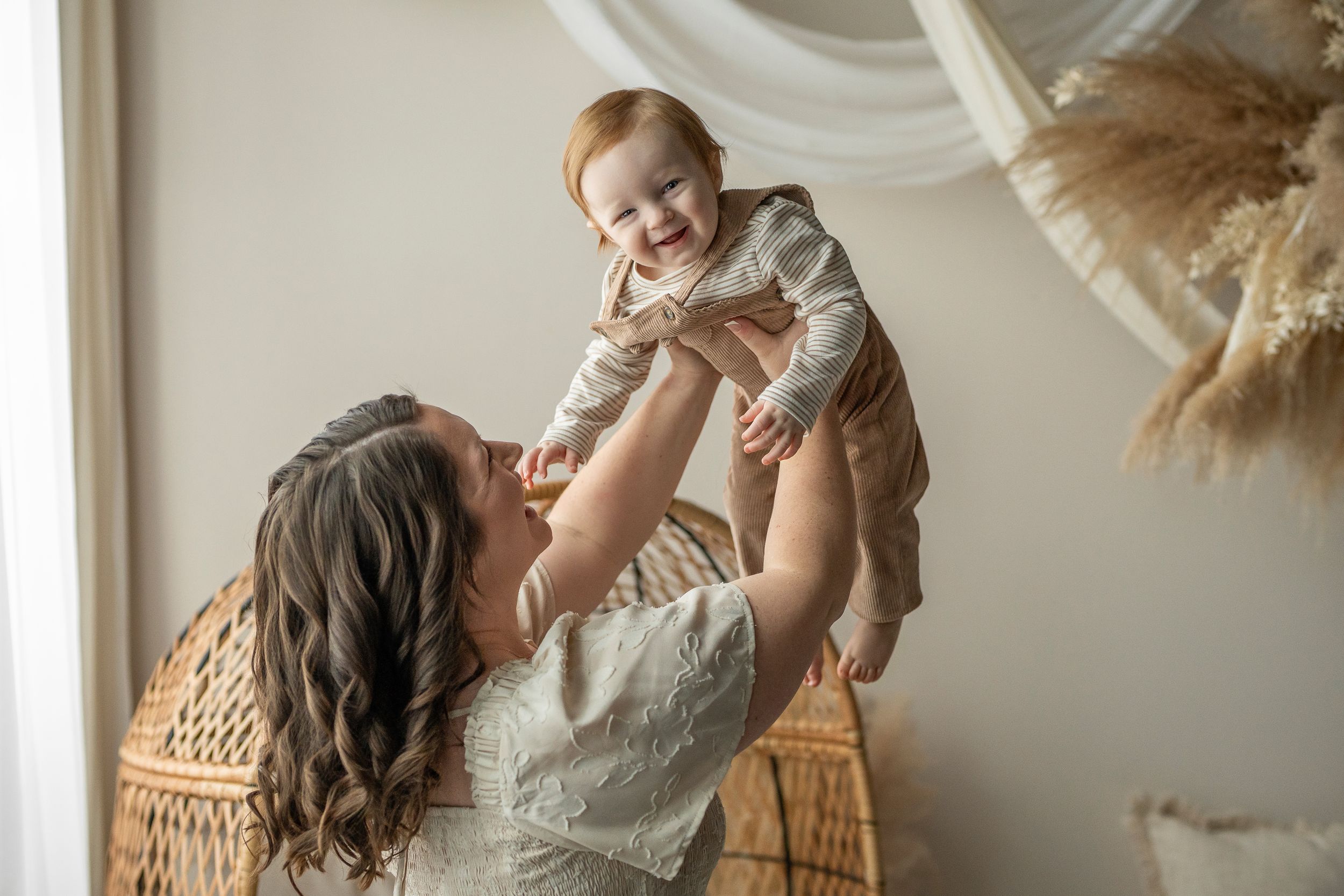 A tender moment captured between parent and baby in a series of connected photos with warm, natural lighting.