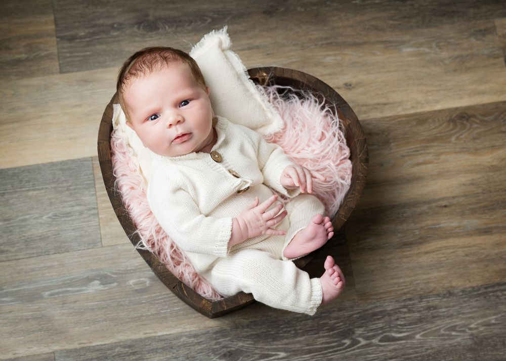 newborn in heart bowl wildflowers photography