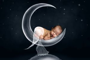 Composite photo series showing sleeping newborn in moon-shaped basket across six phases of the lunar cycle against dark background.