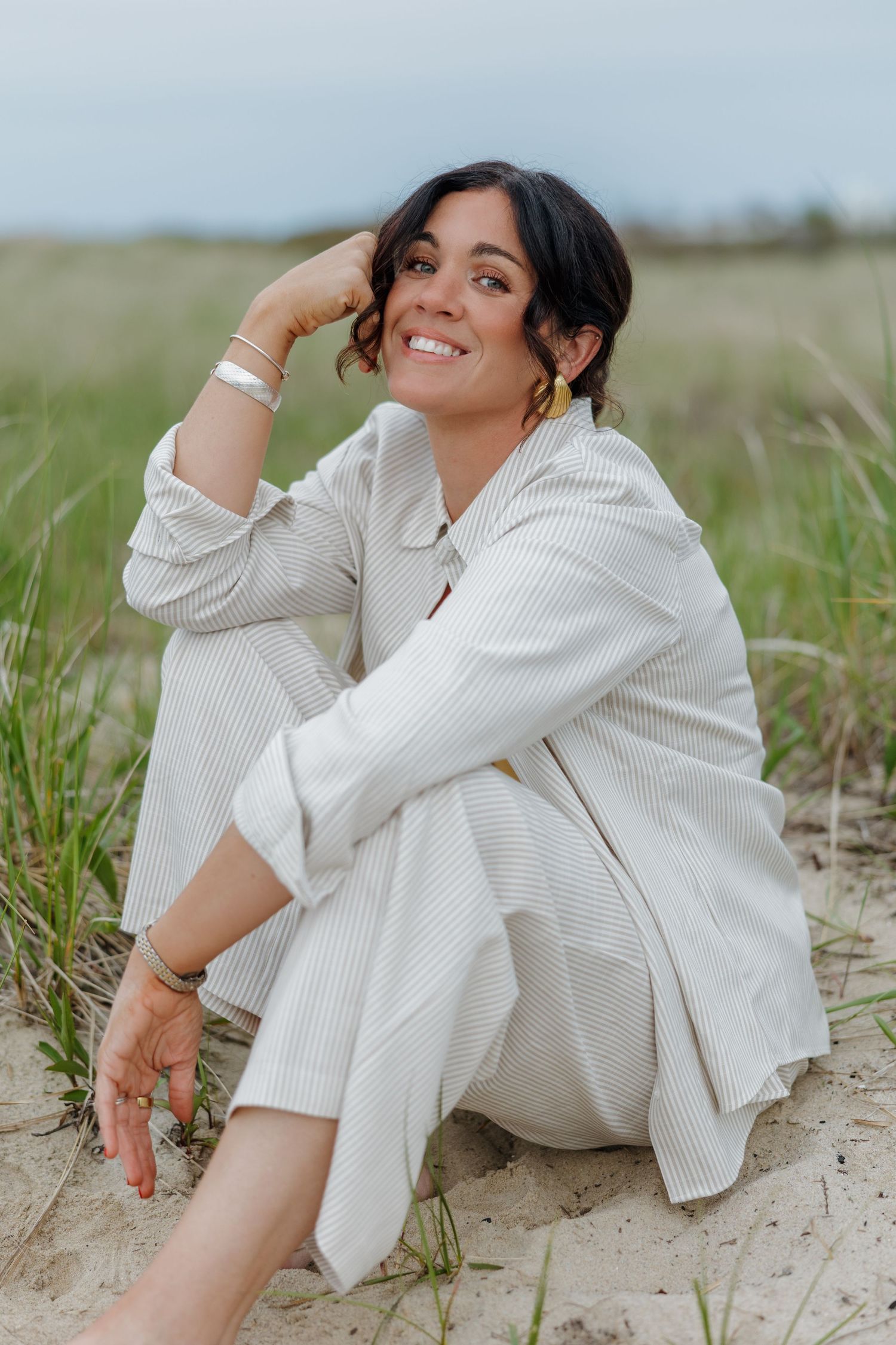 A relaxed lifestyle photo session in a bright white modern room with wooden chairs.
