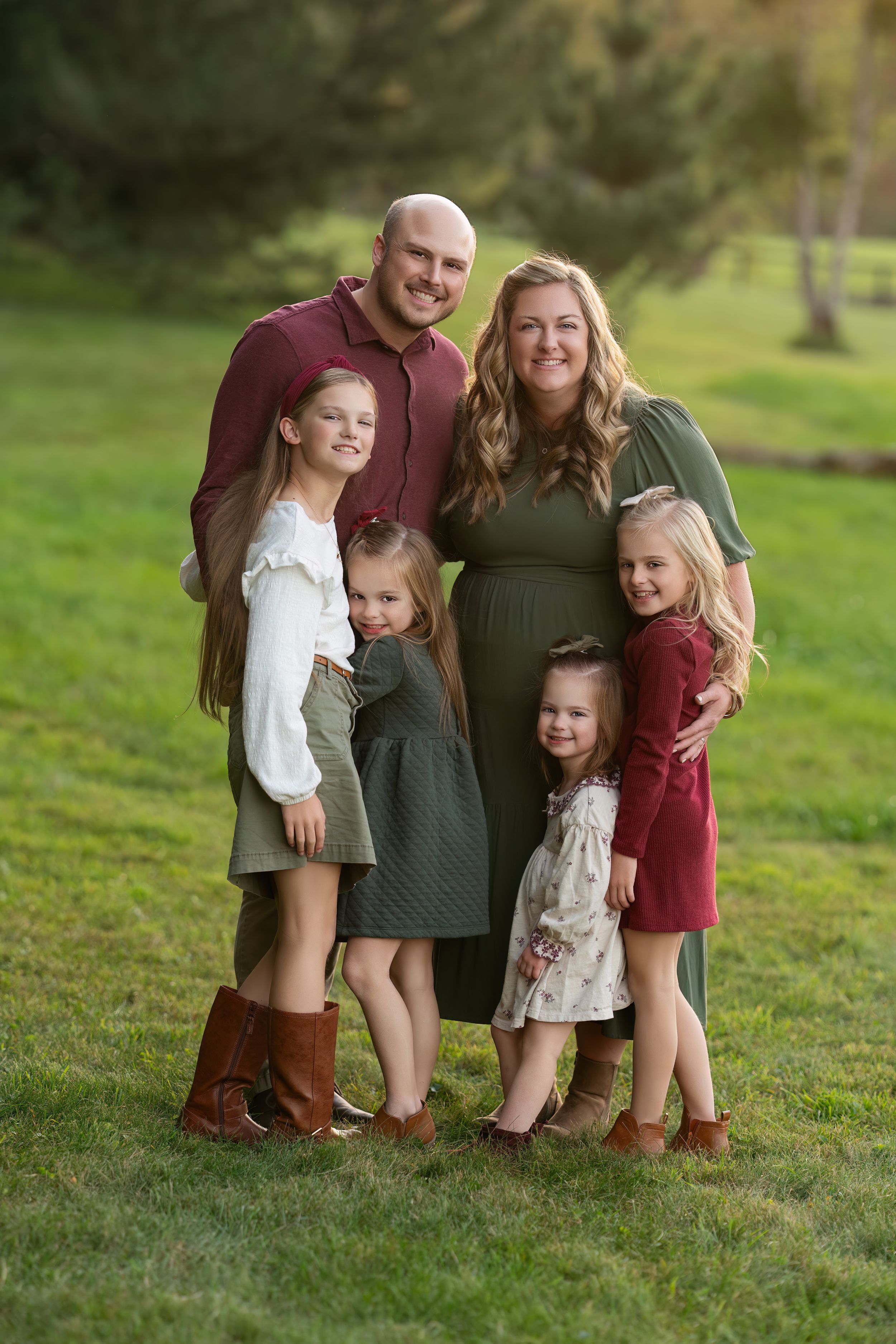 family snuggles in outdoor portrait