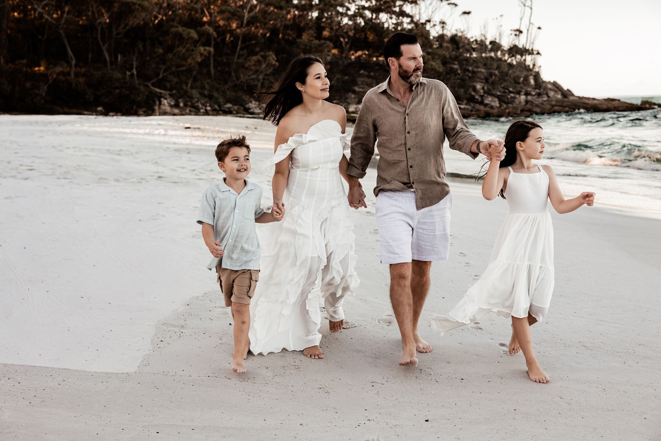 family-beach-photo-session-vincentia-jervis-bay-nsw-family-walking-together-holding-hands