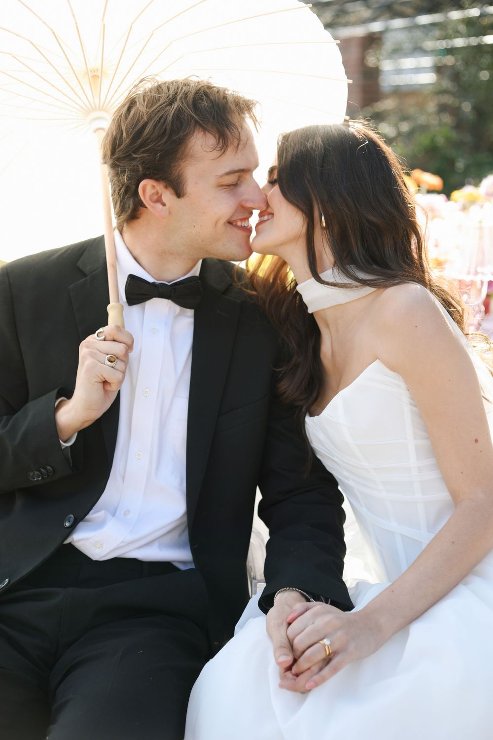 A romantic wedding couple sharing intimate kisses in a series of black and white photos.