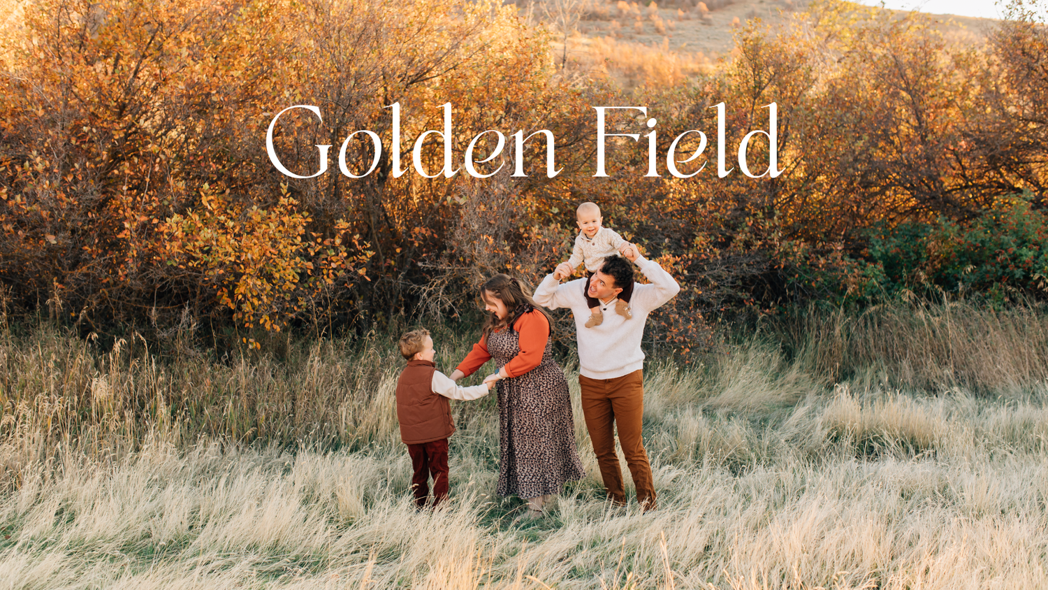A couple lifts their baby joyfully in golden rolling hills during autumn, with text overlay reading Rolling Hills.