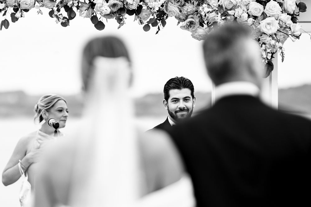 Waterfront wedding ceremony at OceanCliff Hotel in Newport, Rhode Island. Wedding photographer in Newport RI