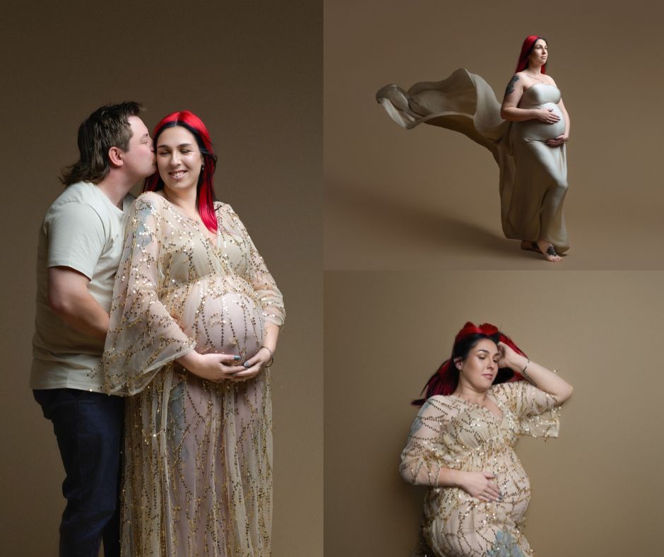 Pregnant woman with red hair poses in a flowing beige chiffon maternity gown against a neutral studio backdrop.