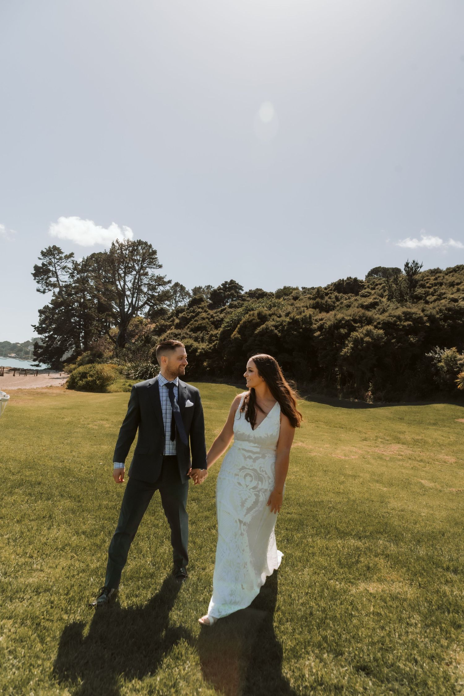 A collage of beach wedding photos showing newlyweds walking along sandy shores with turquoise ocean views.