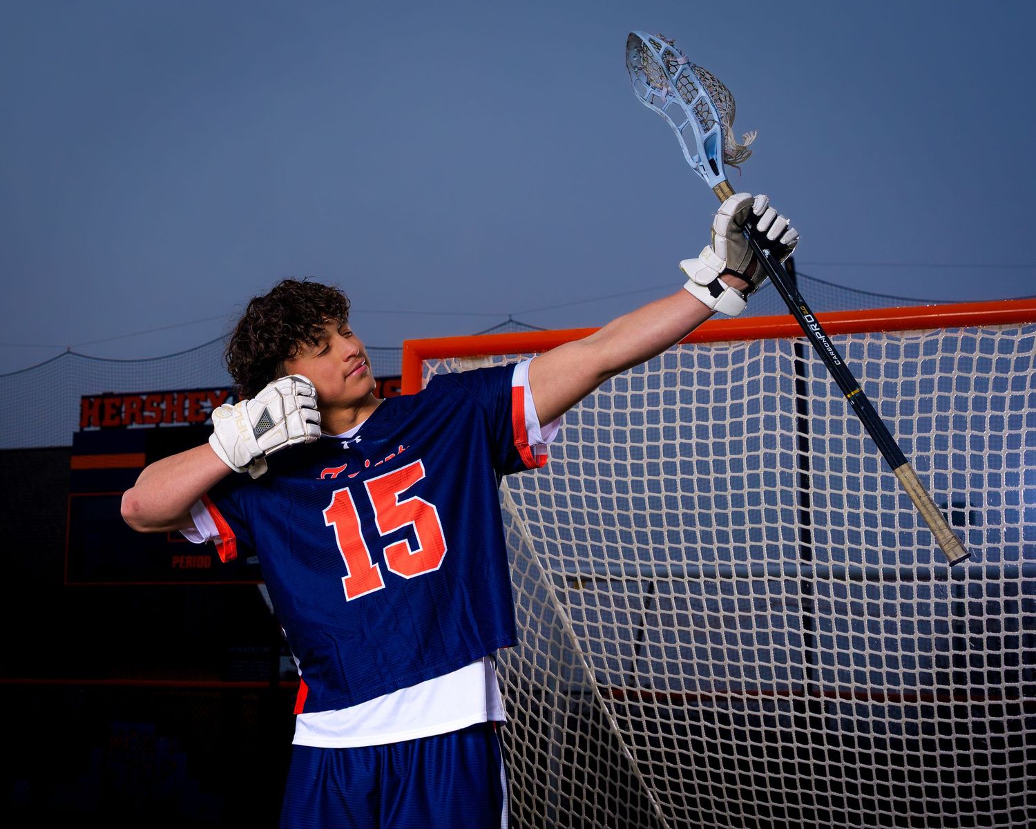 Hershey Trojans boys lacrosse player #15 photo day portrait at the goal, by Deanna Fox, SportsFox Photography based in Hershey PA