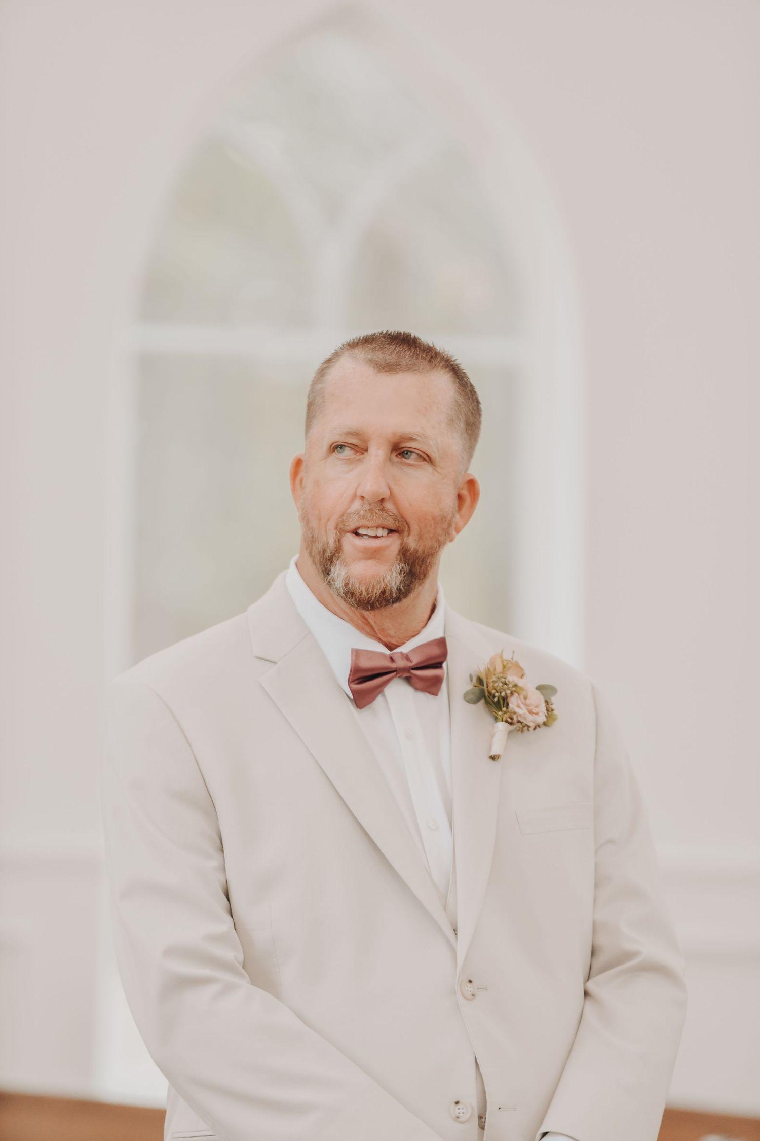 Groom becoming emotional while listening to a custom song from his bride before the ceremony