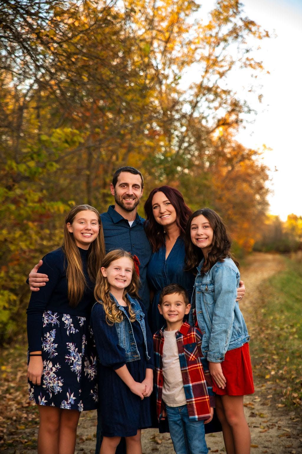 Family poses for seasonal fall photos in St.Marys, Ohio