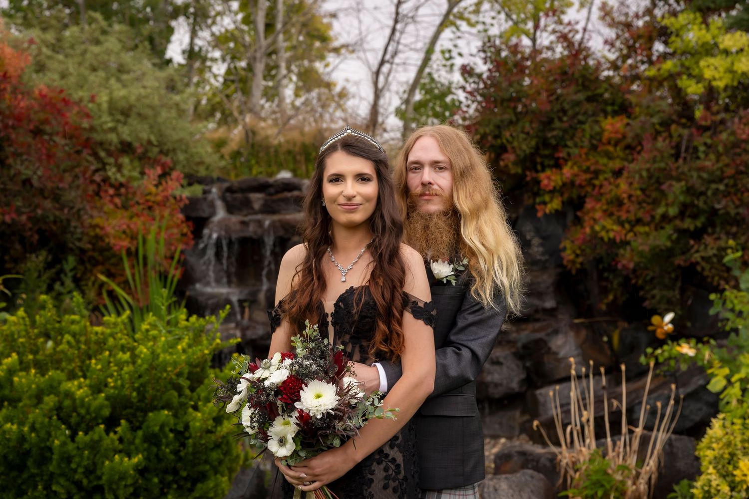 close up of bride and groom in front of water fall Castle Gardens Kuna Idaho ©Milestones Studios LLC