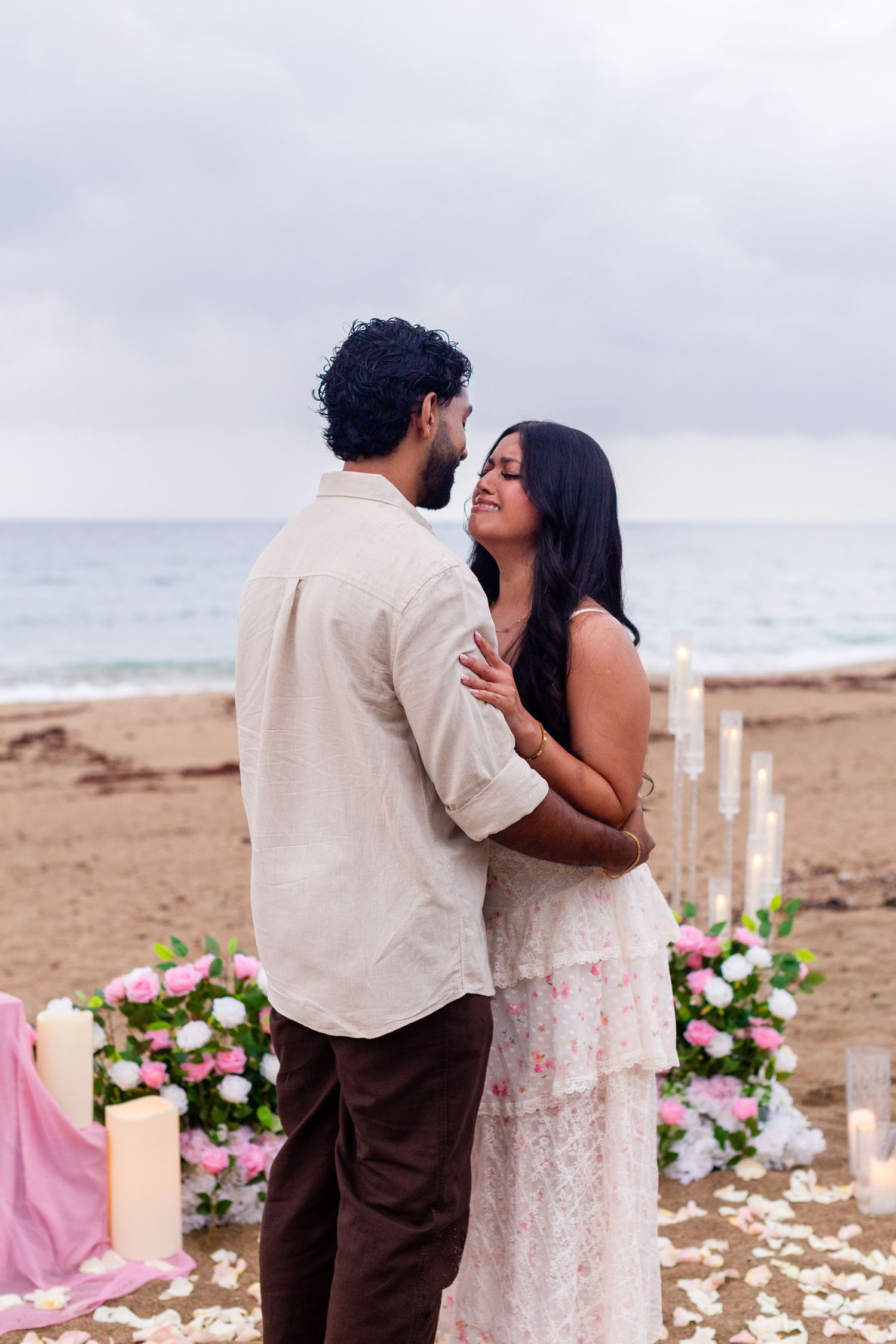 Marriage proposal on the beach with flowers and candles. Playa Guajataca, Isabela, Puerto Rico.