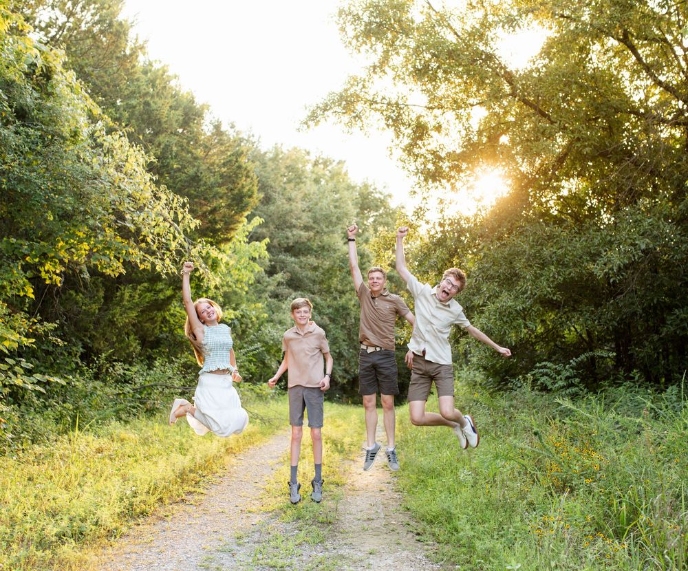 happy kids jump in family session ofallon