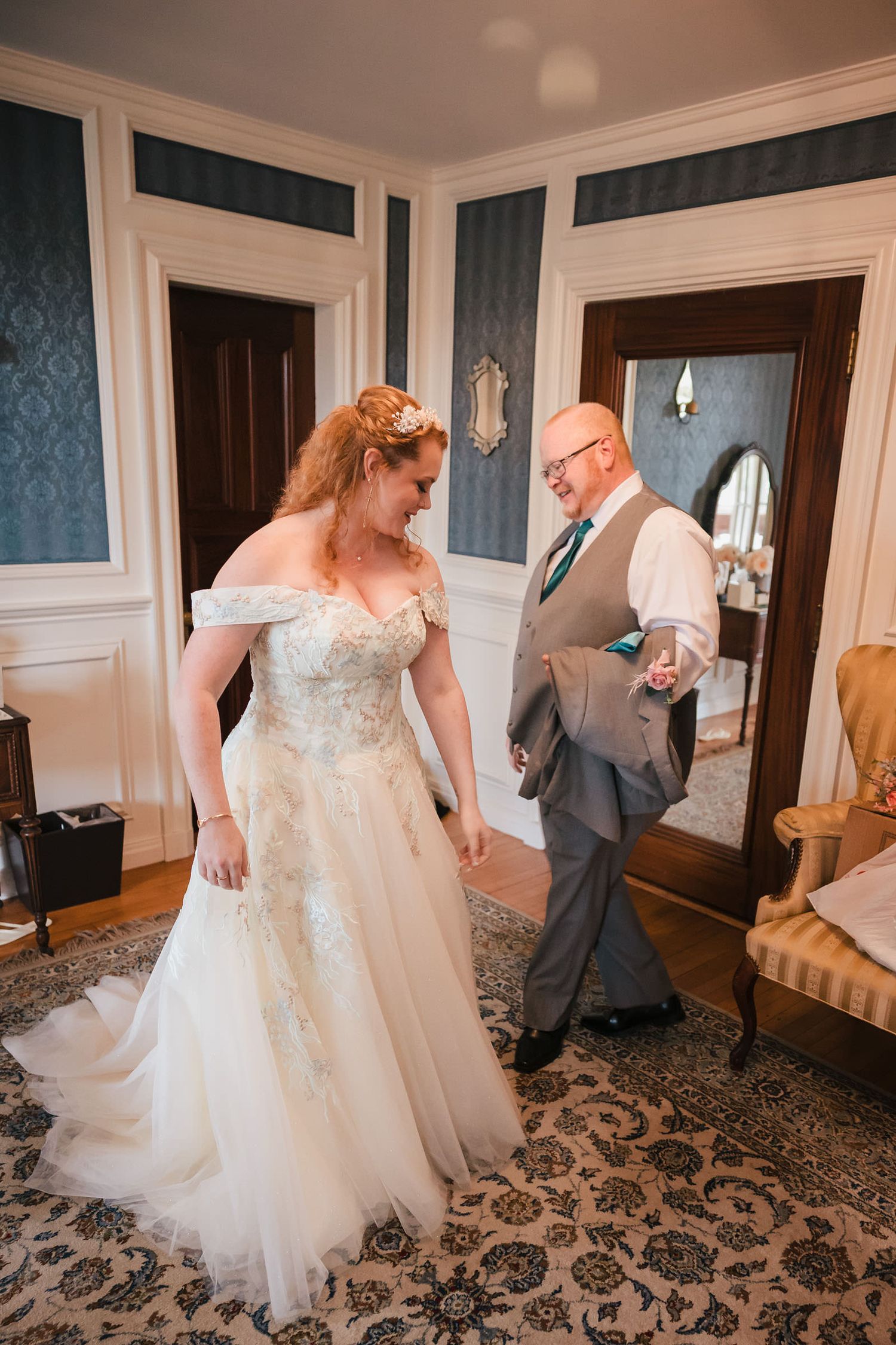Bride and her father laughing together moments after their emotional first look.