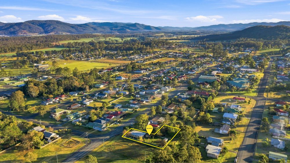 Drone aerial real estate photo on the mid north coast nsw with boundary highlighted in real estate agents branding colours
