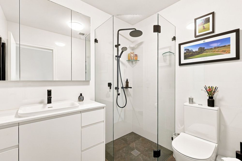 Bathroom real estate photo with crisp white tones for elite real estate photo shoot in Manly NSW