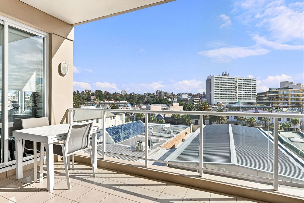 Hunter Valley Real Estate Photographer presenting an image of a balcony with blue sky image editing skills for this real estate listing.