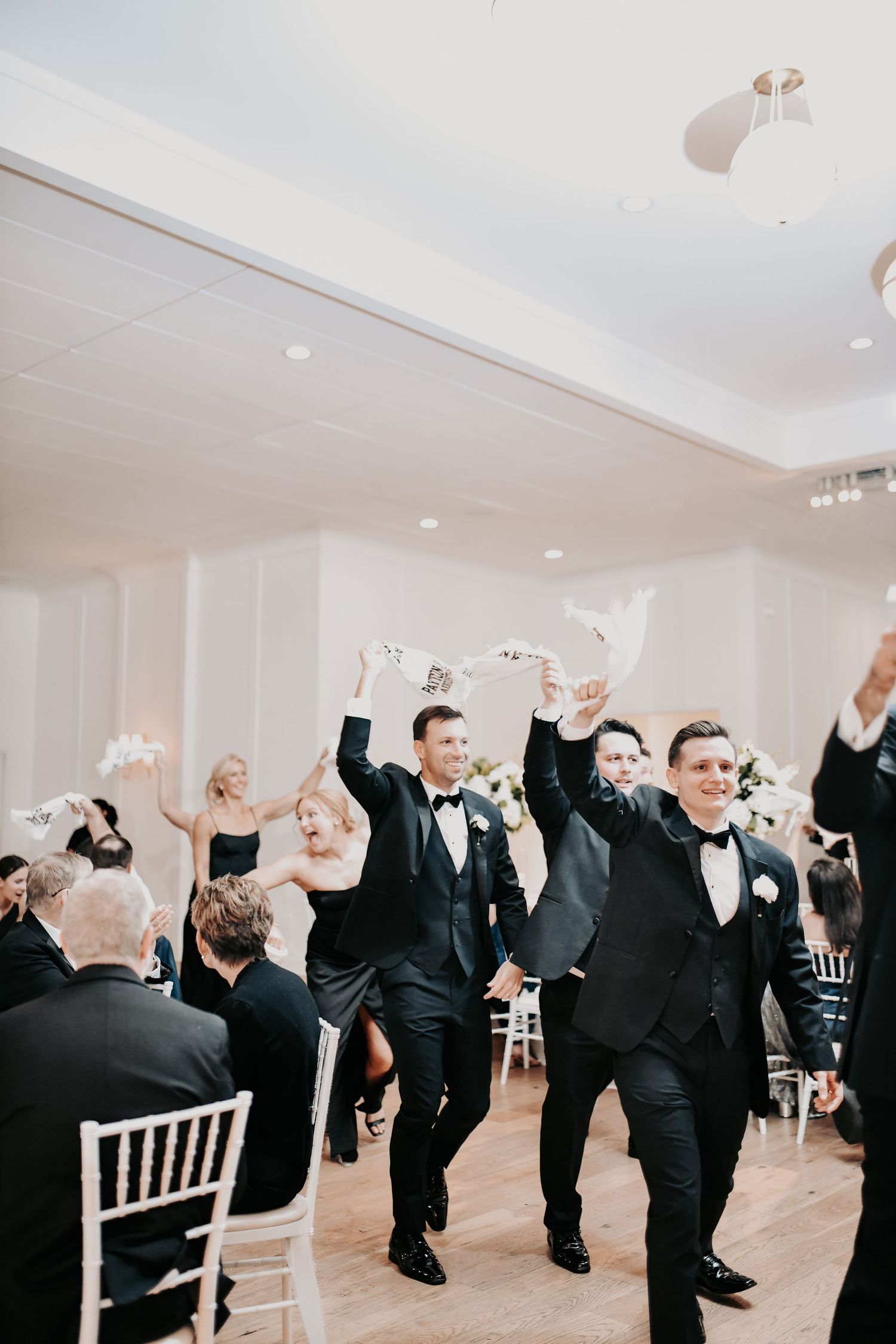 Newlyweds celebrating during their Dallas wedding reception entrance