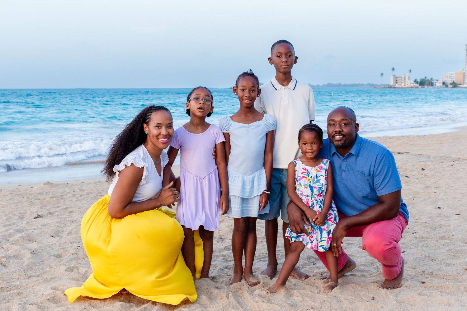Family portrait. Mom, dad, and four kids on the beach in Isla Verde, Carolina, Puerto Rico.