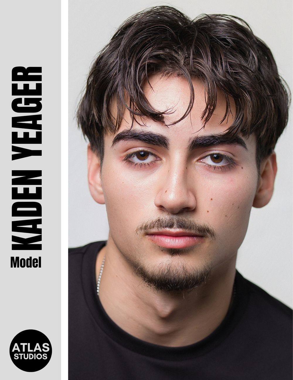 Kaden Yeager male model headshot with dark hair and bold brows, Atlas Studios portfolio photo.