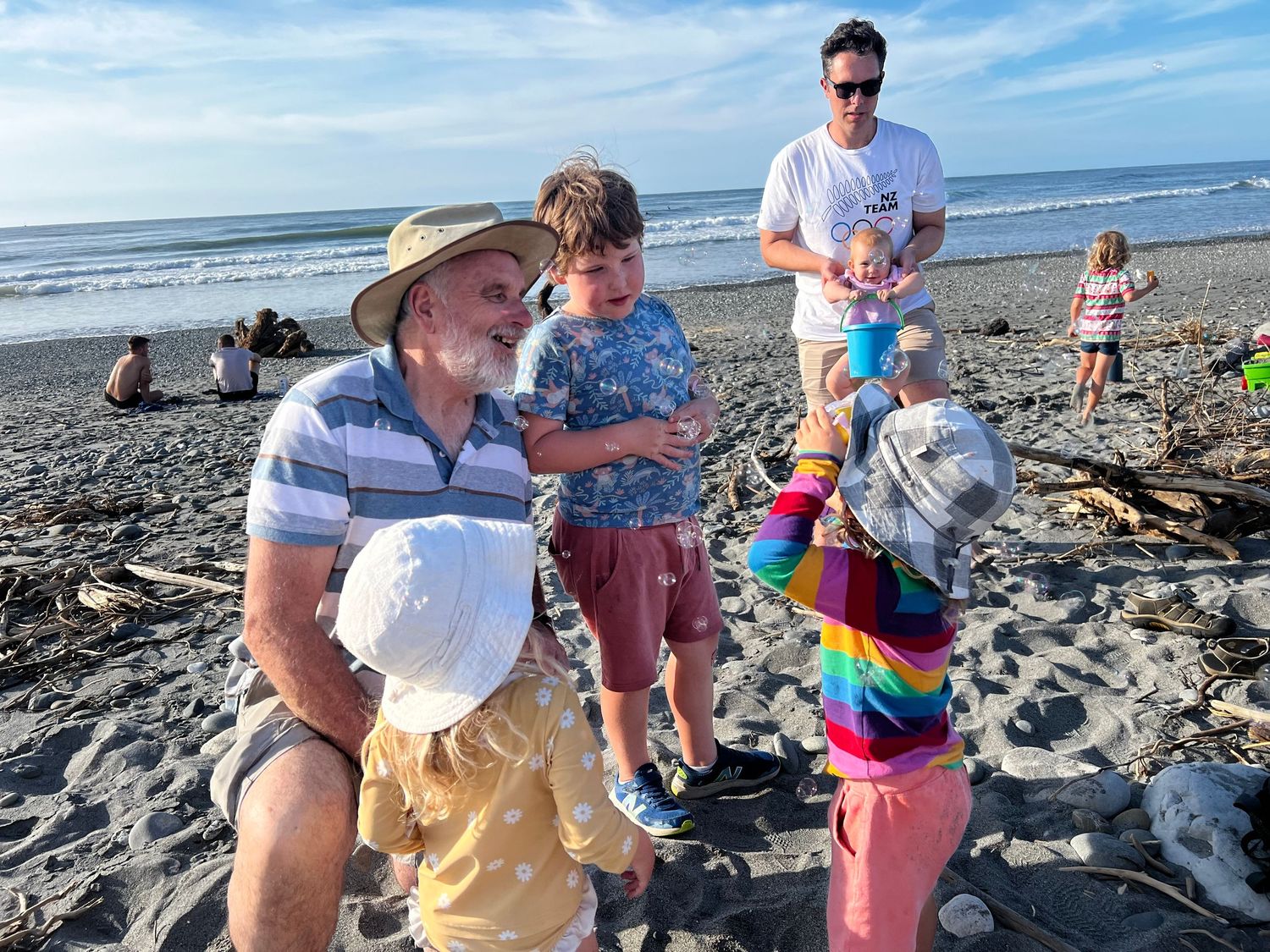 stewart nimmo at Cobden beach with grandkids