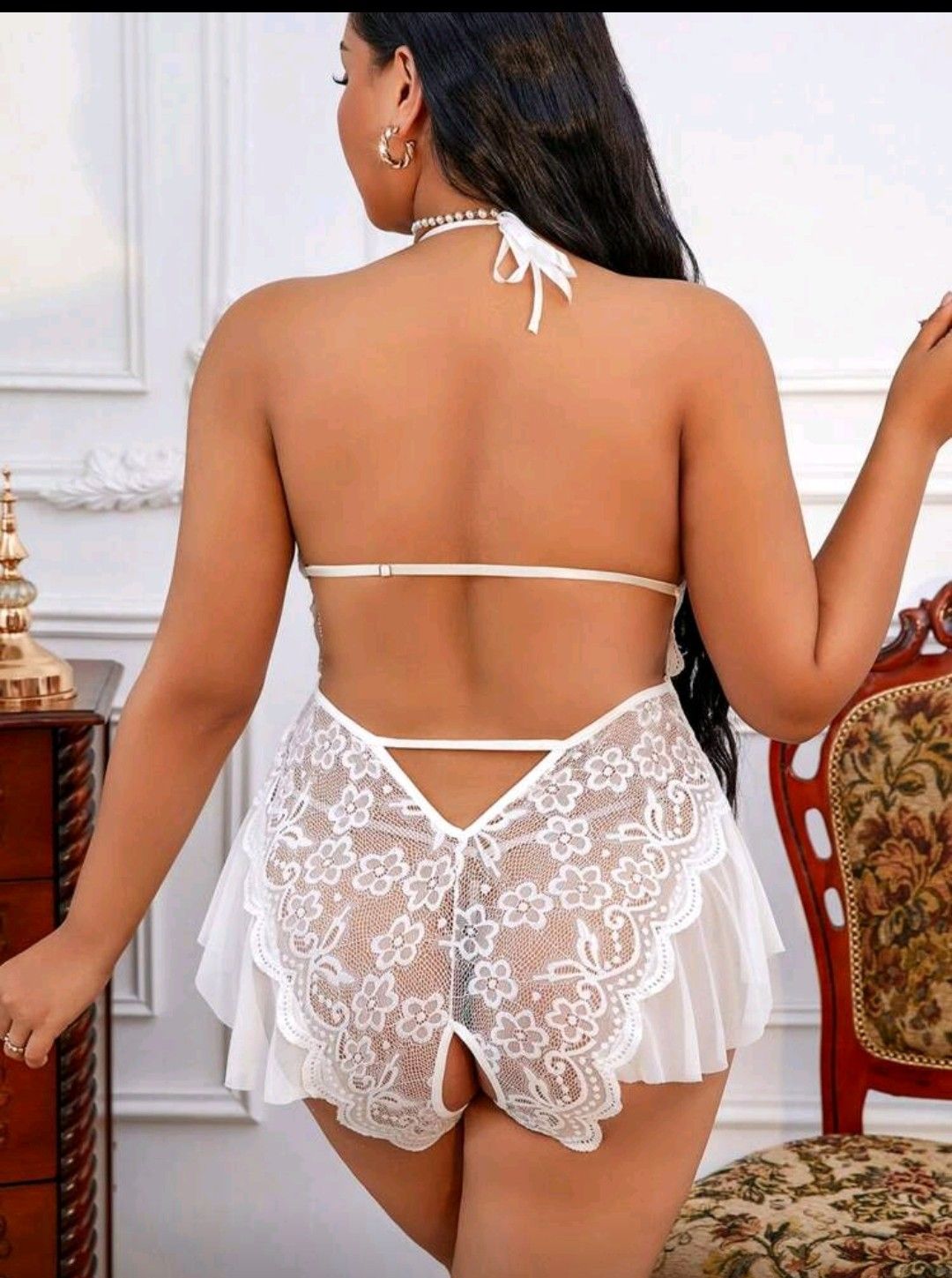 White floral lace babydoll lingerie with ruffled hem, halter neck tie, and strappy open back design.
