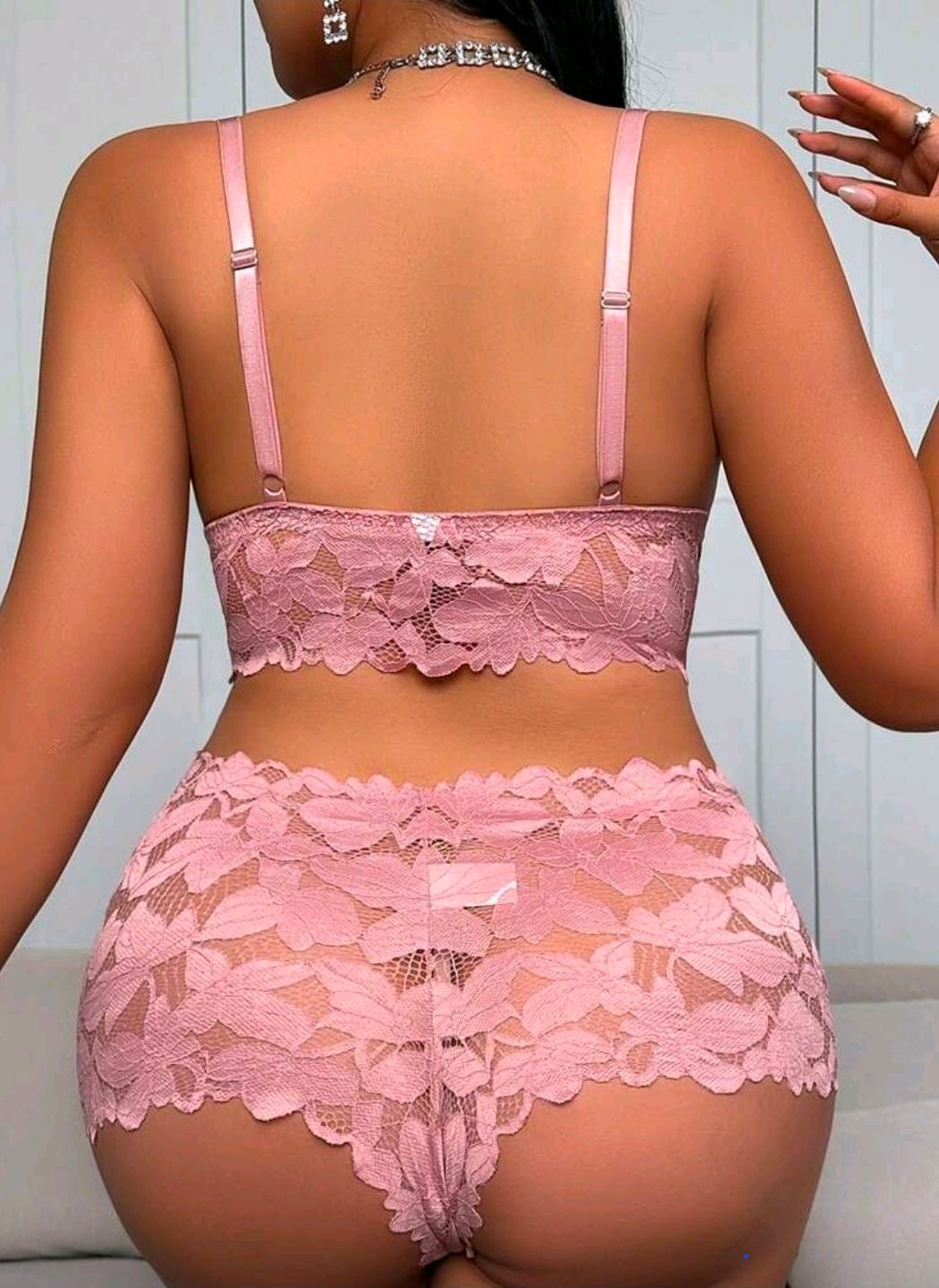 Pink lace lingerie set featuring a crop bralette and high-waist cheeky shorts with floral scalloped edges.