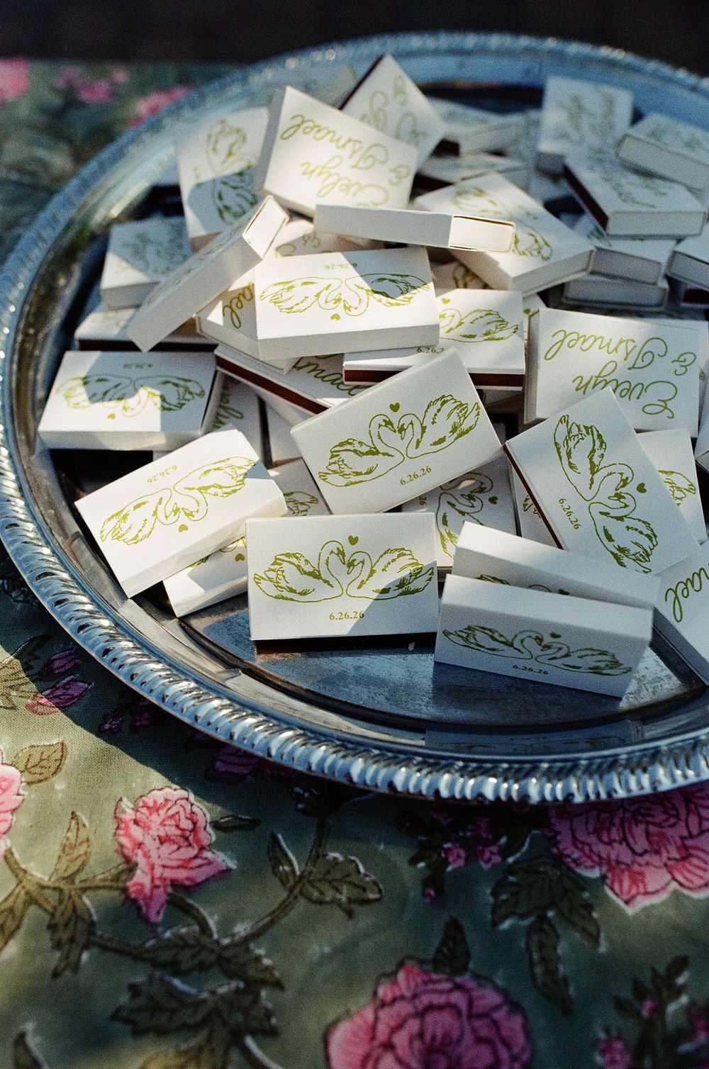 Wedding details of custom matchbooks photographed on film photography in Los Angeles.