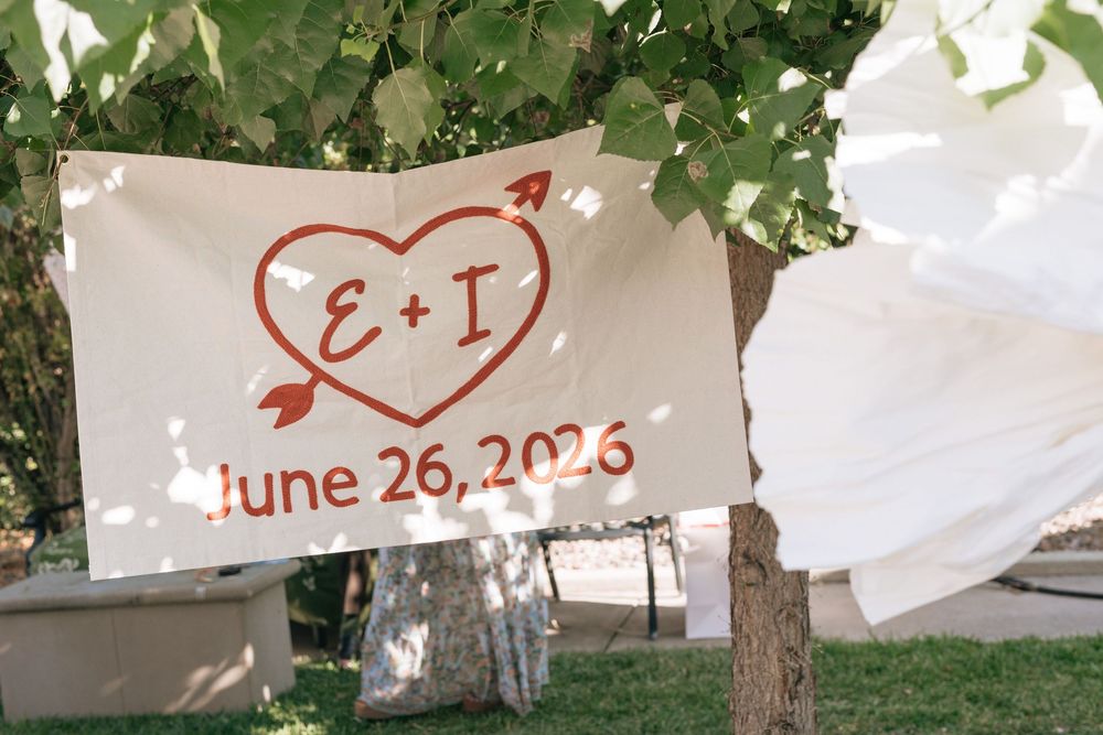 Backyard wedding sign with couples initials.