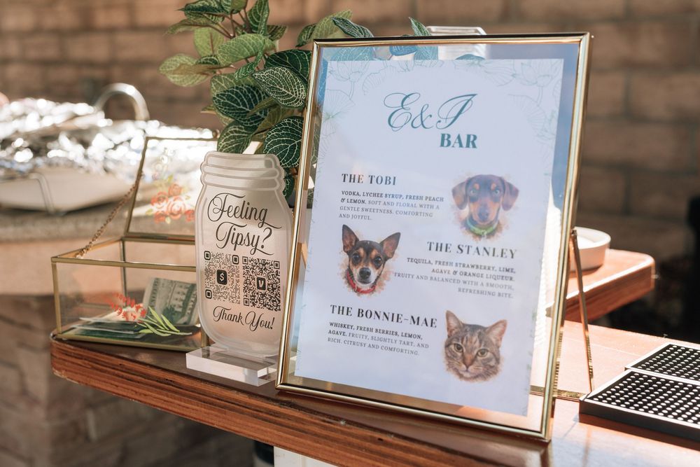 Bar custom sign with couples signature wedding drinks.