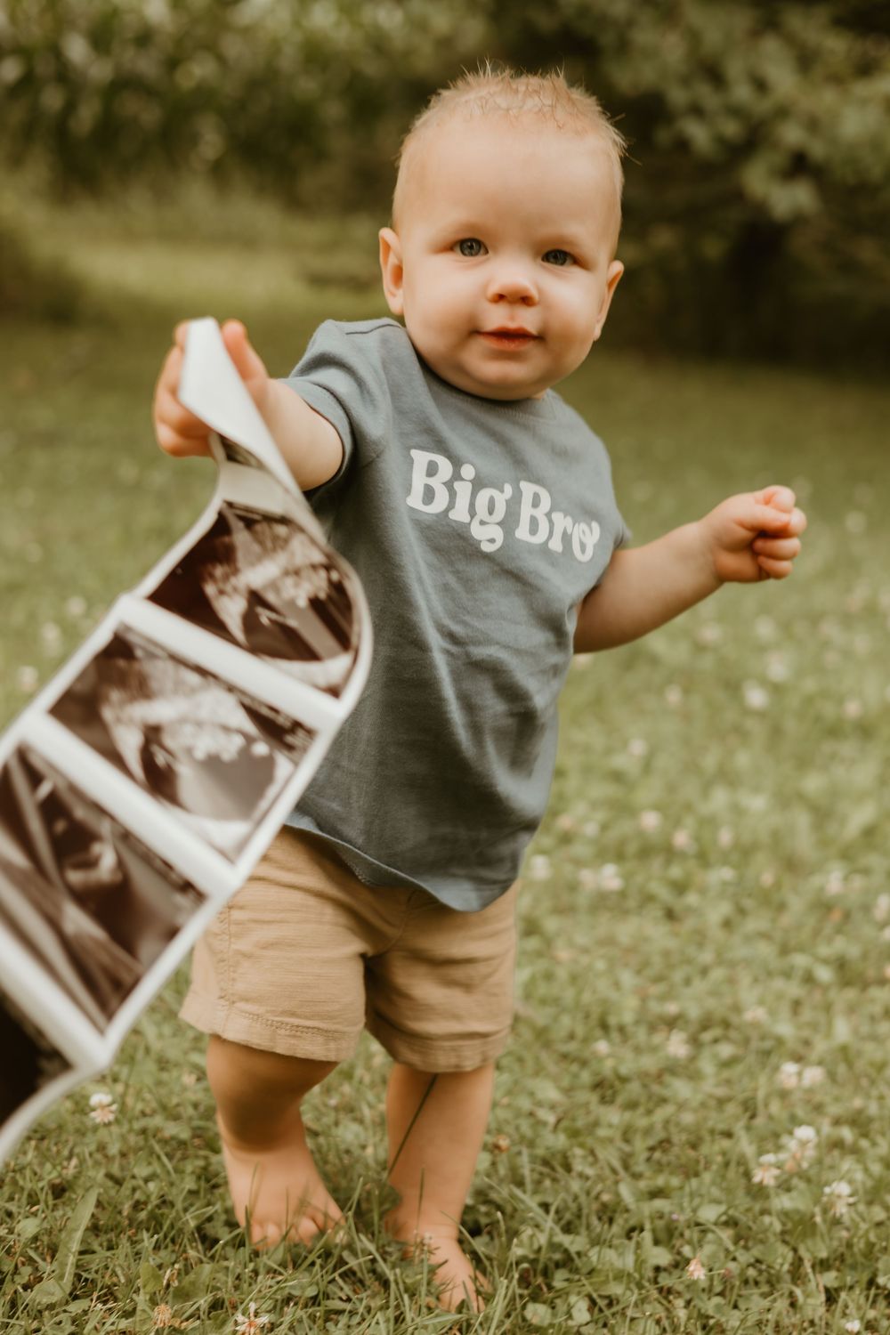 big brother holding ultrasound