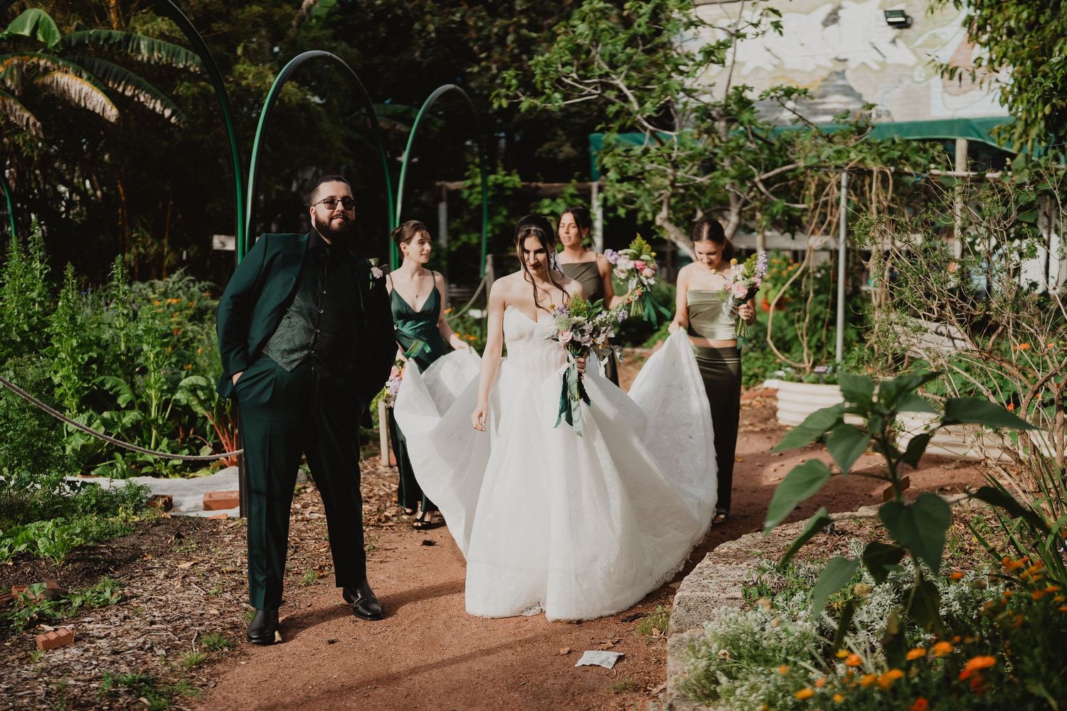 Harrison and Ella among the greenery with Ella's veil flowing, Perth wedding photography