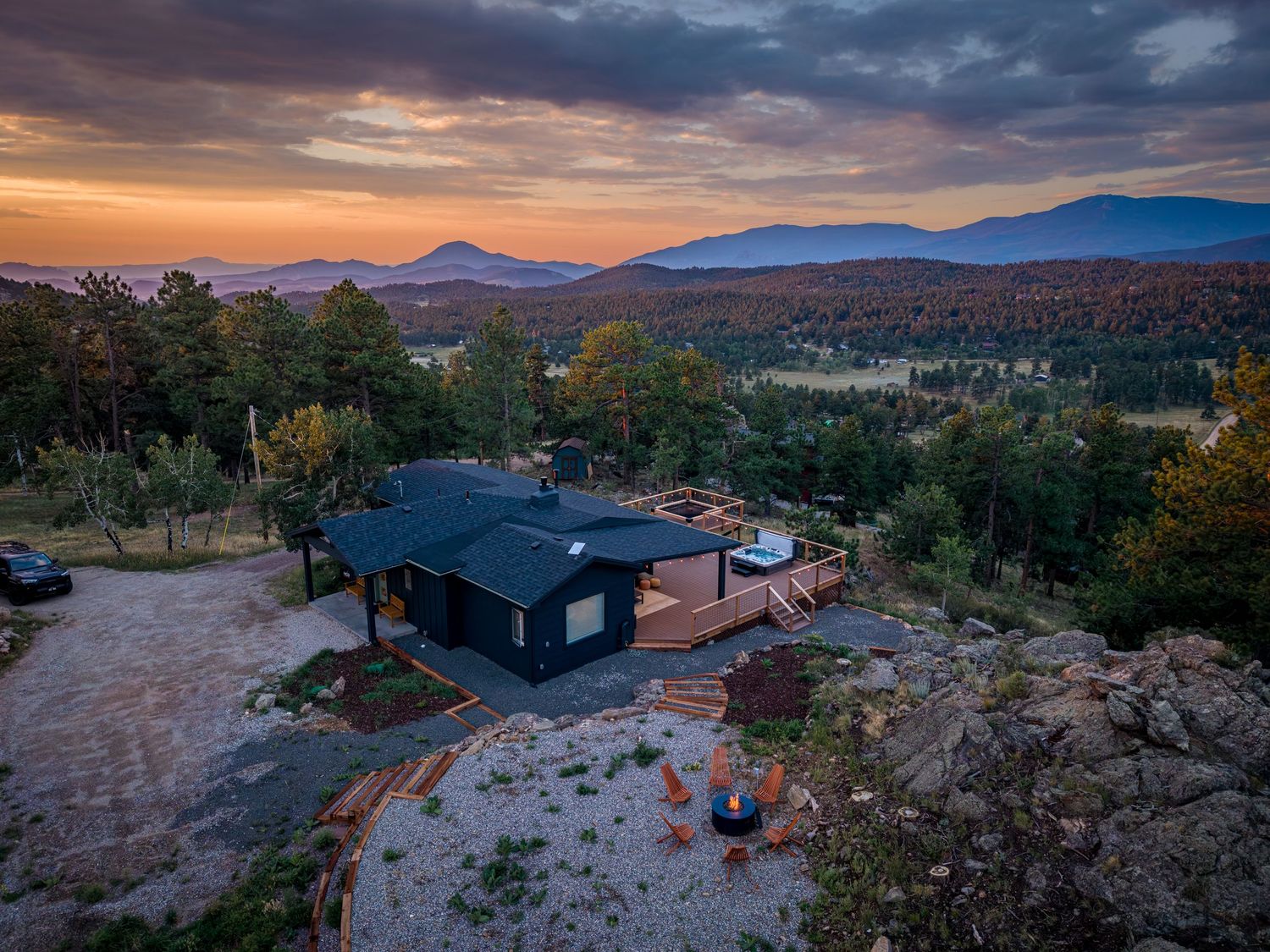Aerial/drone shot of the luxury vacation rental, the Selah House, at sunrise in Bailey, CO.